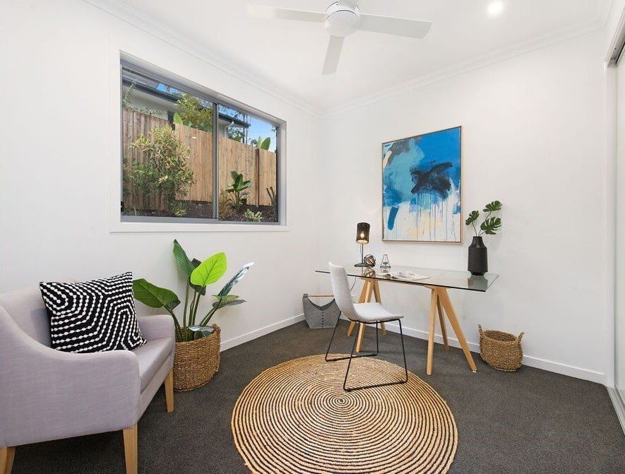 A Living Room With A Couch , Chairs , And A Table  — Norm Evans Floors Pty Ltd in Kunda Park, QLD