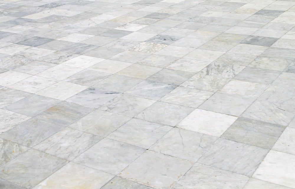 A Close Up Of A White Marble Tile Floor — Norm Evans Floors Pty Ltd in Maroochydore, QLD