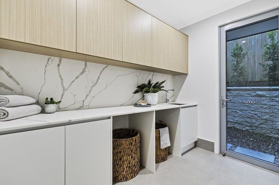 A Laundry Room With A Large Window And A Sliding Glass Door  — Norm Evans Floors Pty Ltd in Kunda Park, QLD