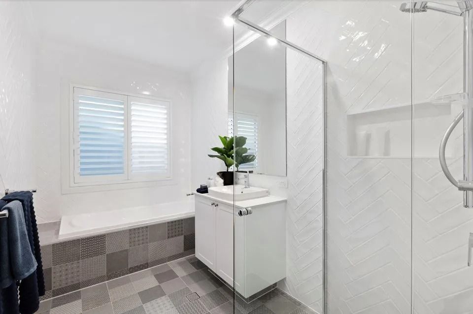A Bathroom With A Walk In Shower , Sink , And Tub  — Norm Evans Floors Pty Ltd in Kunda Park, QLD