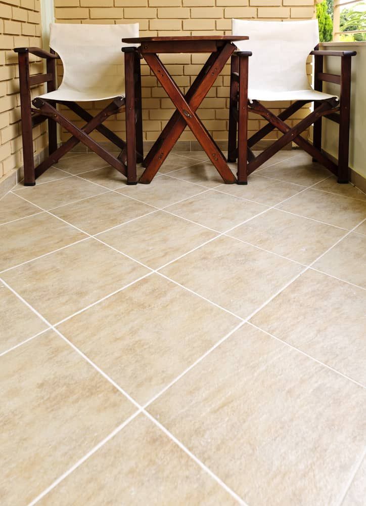Two Folding Chairs And A Table On A Tiled Floor  — Norm Evans Floors Pty Ltd in Kunda Park, QLD