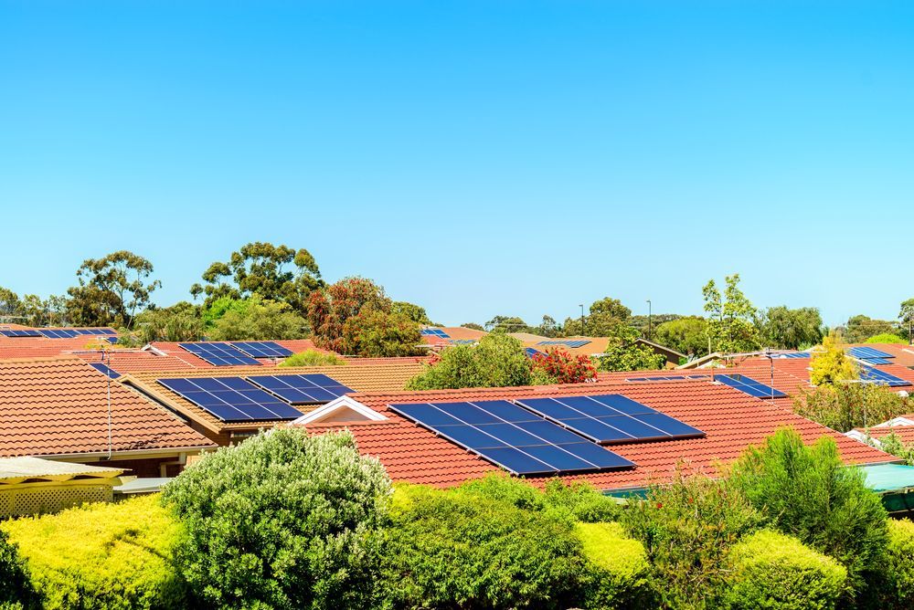 There Are Many Solar Panels On The Roof Of A House — Hybrid Power Australia In Emerald, QLD