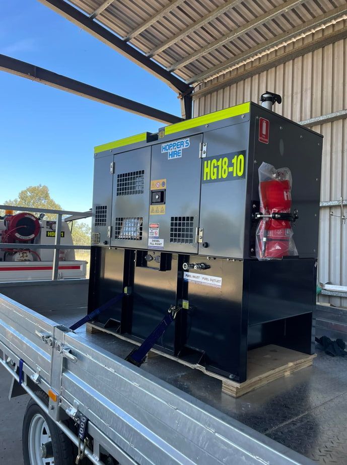 A Generator Is Sitting In The Back Of A Truck — Hybrid Power Australia In Tieri, QLD