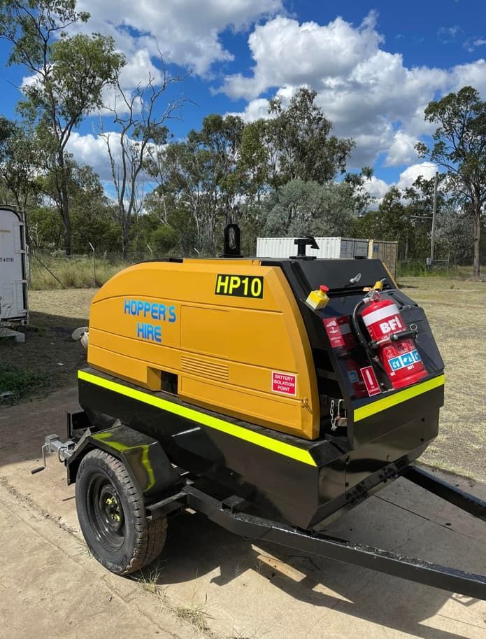 A Yellow And Black Machine Is Parked On A Trailer — Hybrid Power Australia In Blackwater, QLD