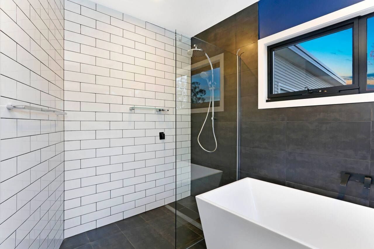 Contemporary white bathroom wall tiles, enhancing your space with a clean and modern aesthetic — Tiles in East Corrimal, NSW