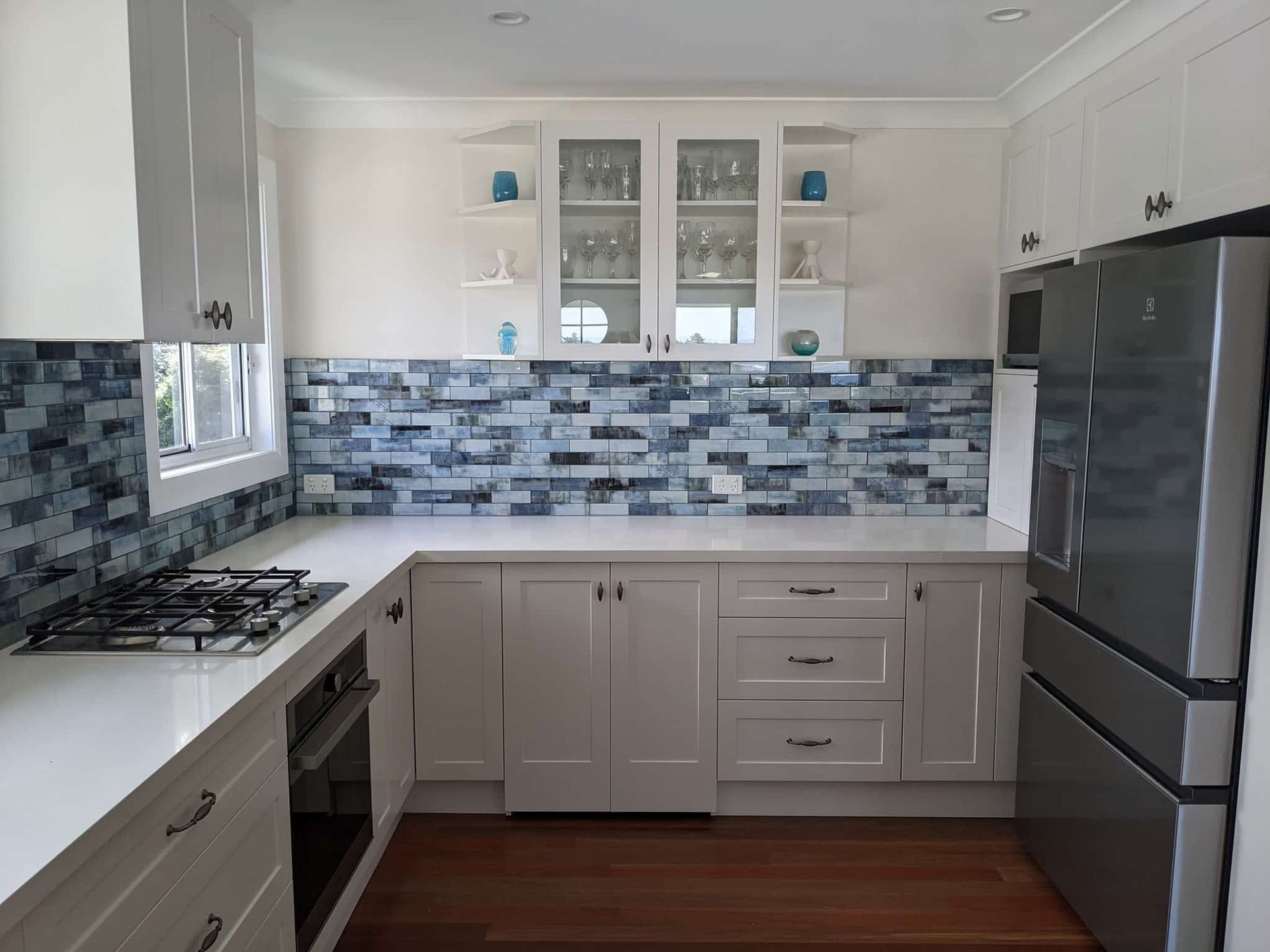 Elegant kitchen featuring stunning designed splashbacks — Tiles in East Corrimal, NSW