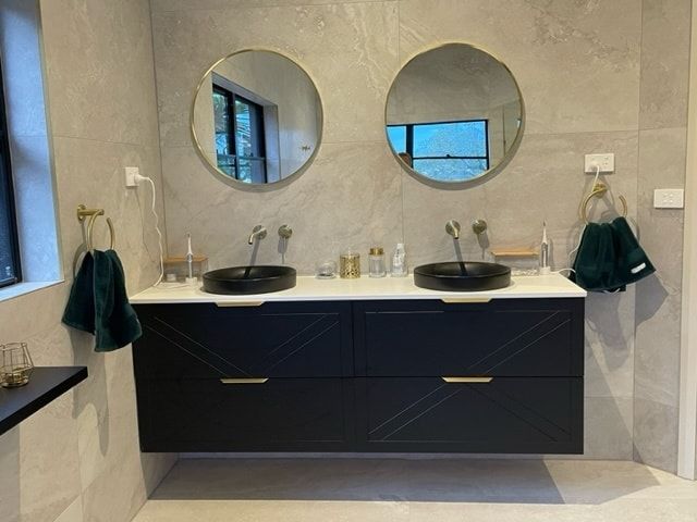 A Bathroom With Black Vanity — Corrimal Discount Tiles and Bathroomwear in East Corrimal, NSW