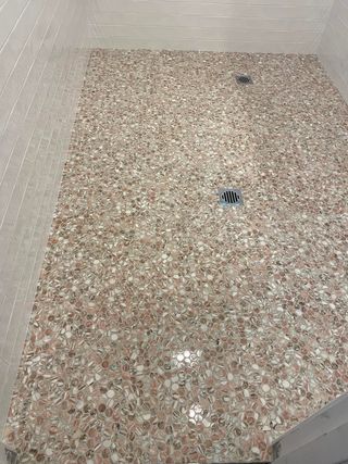 A Shower Floor With Small, Speckled Pink and Mosaic Tiles — Corrimal Discount Tiles and Bathroomwear in East Corrimal, NSW