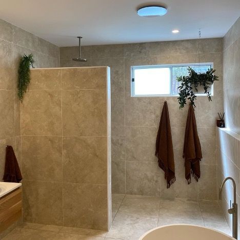 A Bathroom with a Walk-In Shower and a Tub — Corrimal Discount Tiles and Bathroomwear in East Corrimal, NSW