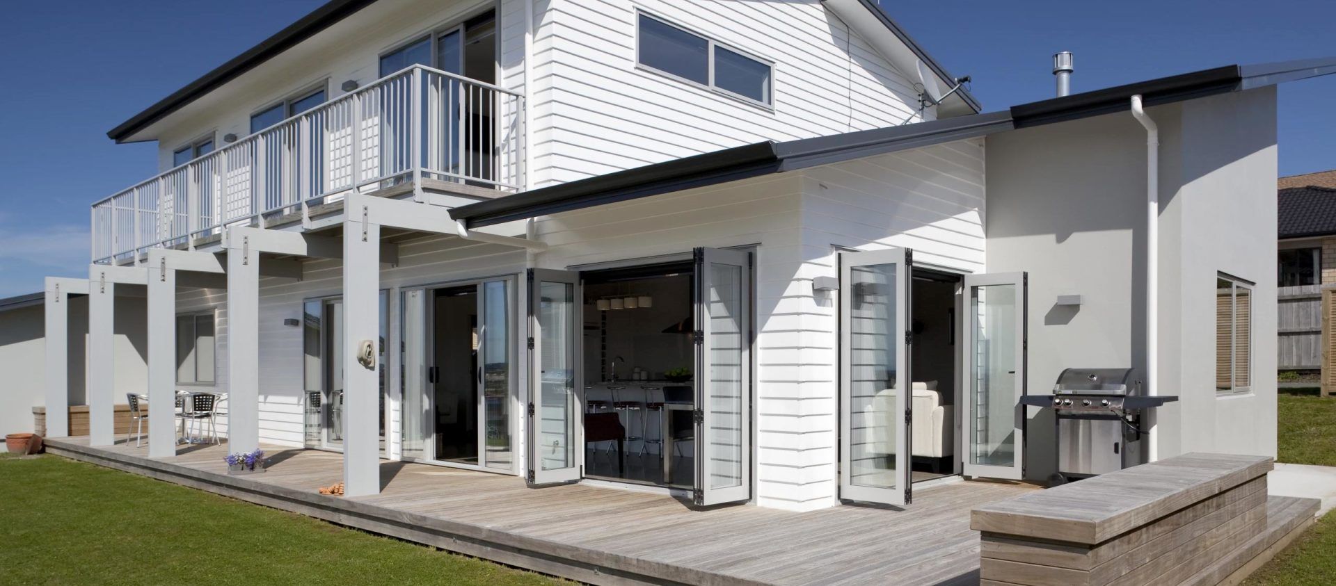 A white house with a lot of windows and doors