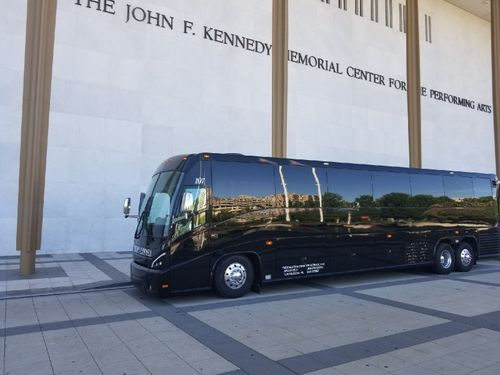 Bus in front of memorial center | Tuscaloosa AL | Tuscaloosa Charter Service