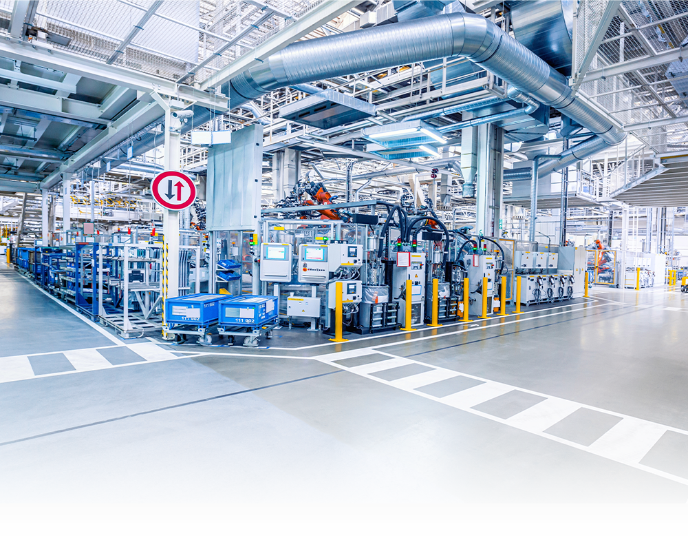 A factory with a lot of machinery and a lot of pipes.
