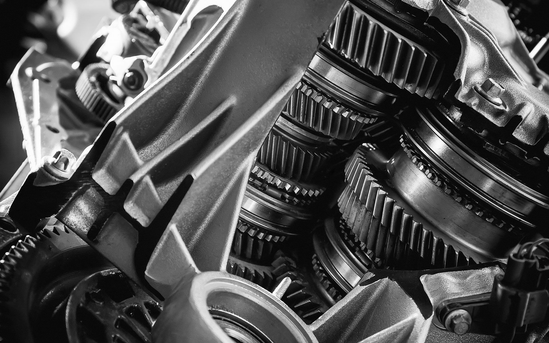 A black and white photo of a machine with a lot of gears