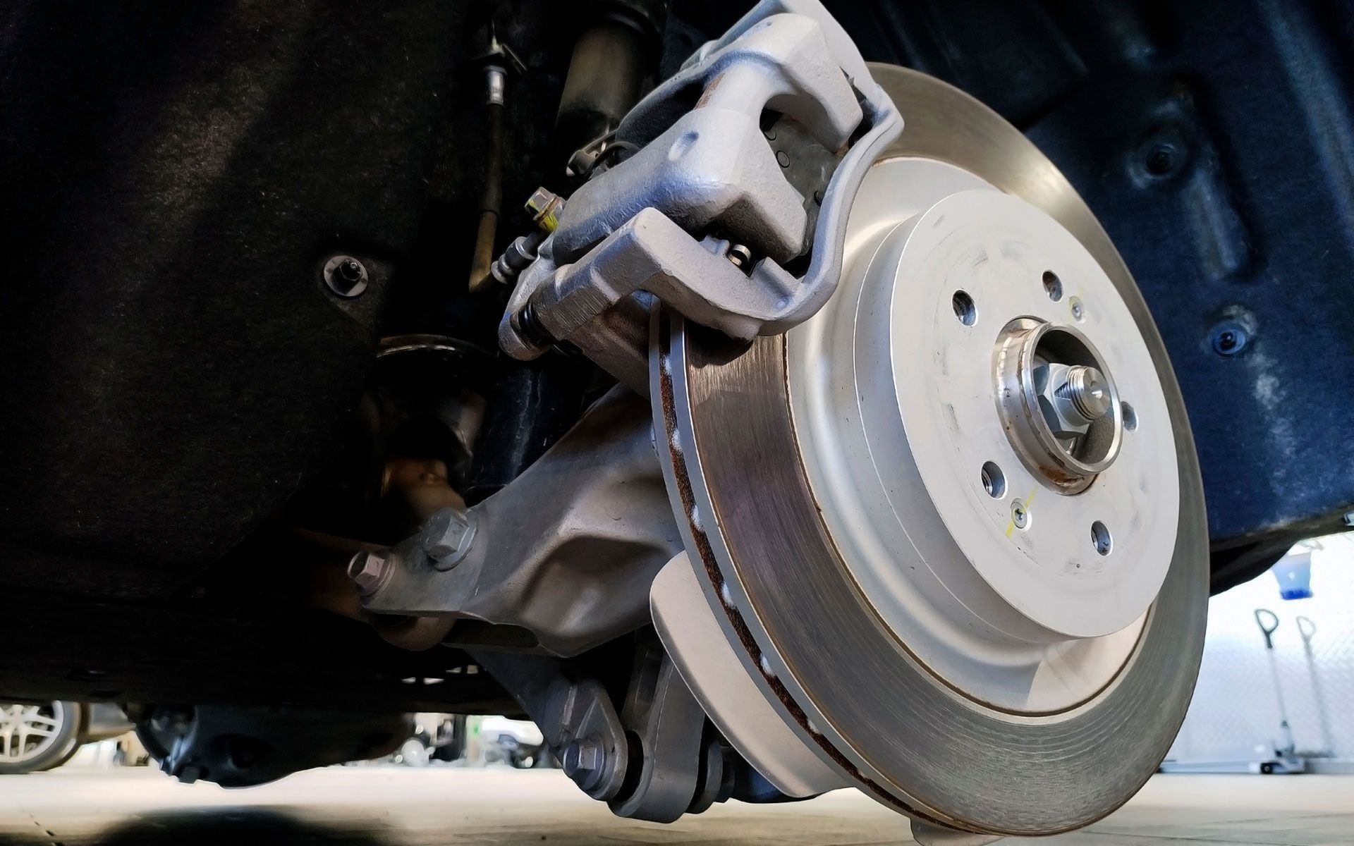 A close up of a brake disc on a car