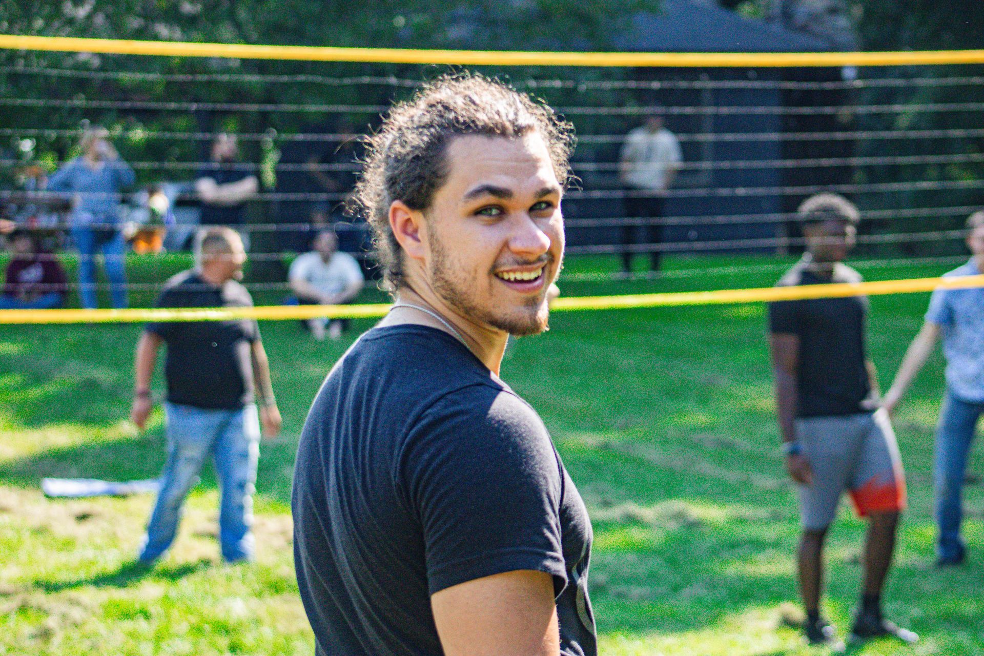 a male student in a volleyball field