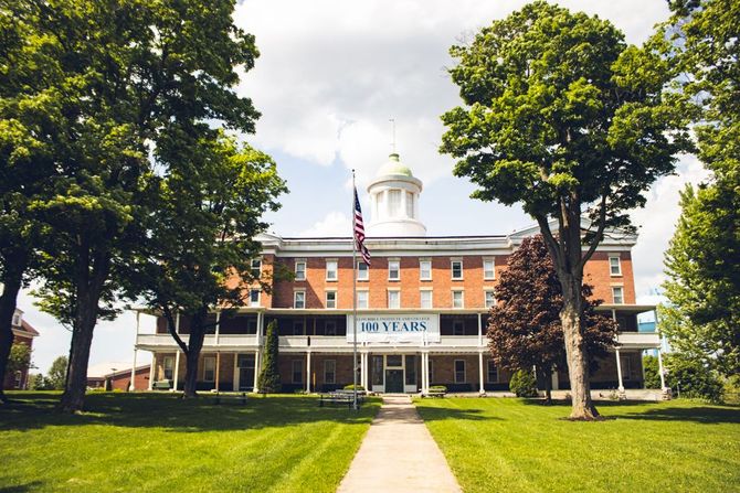 Historic Spencer Hall with our 100 Years banner 