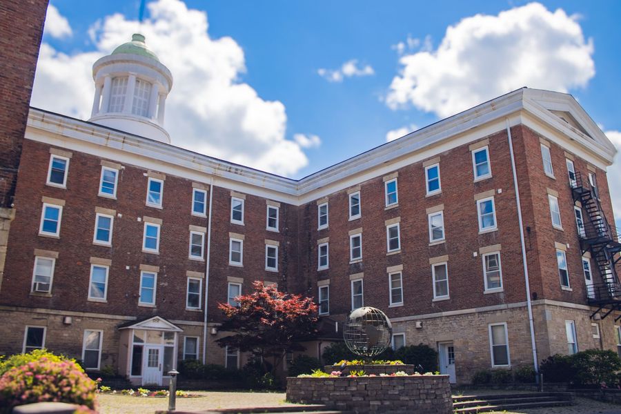 a picture of Spencer Hall building with globe 