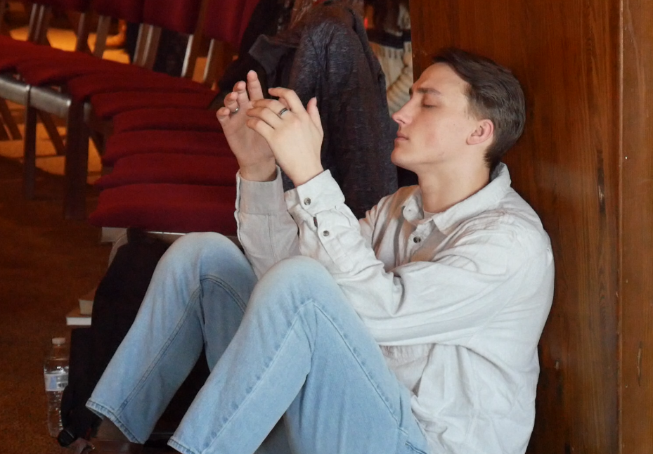 a student praying during week of prayer