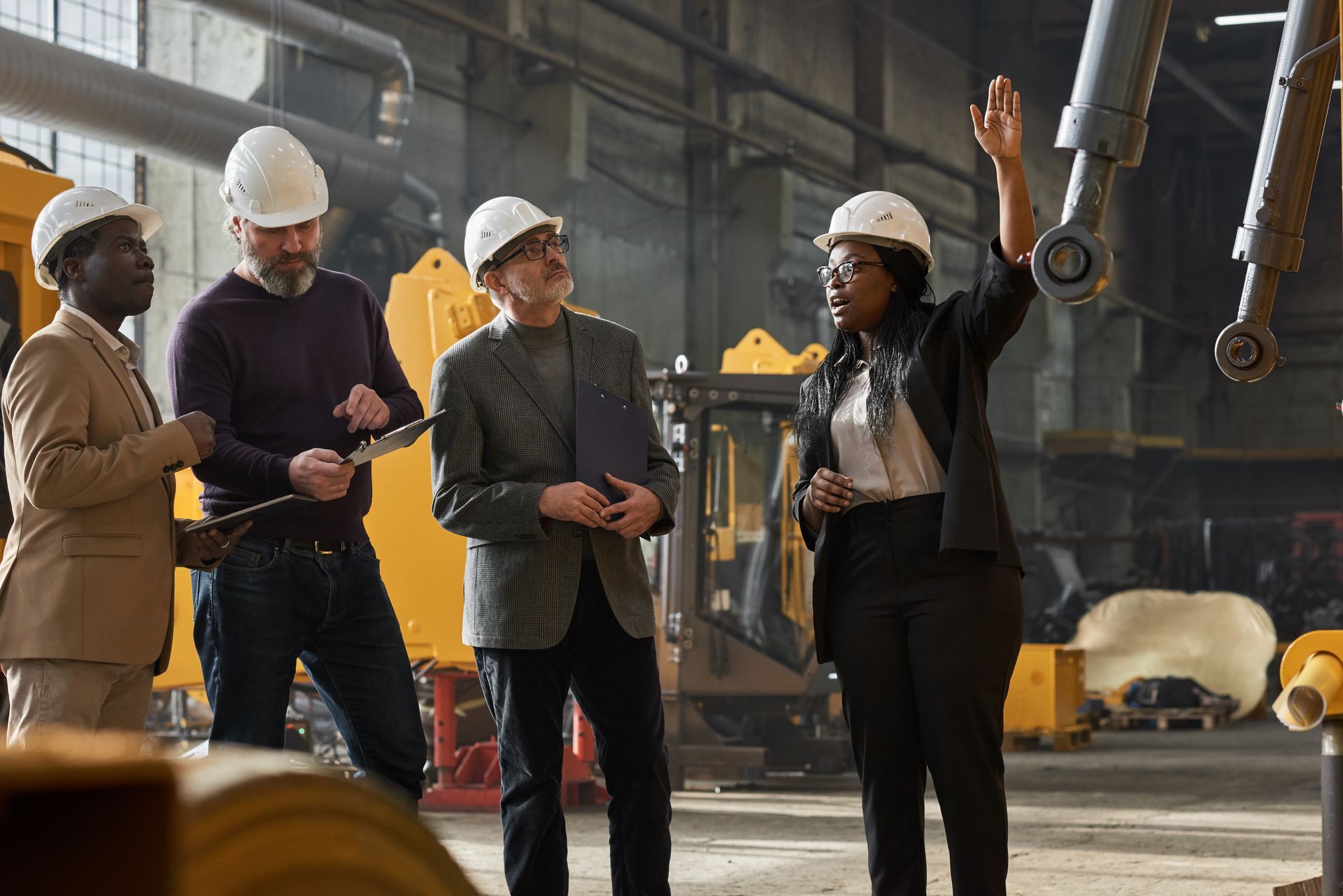 businesspeople wearing hard hats at a construction site