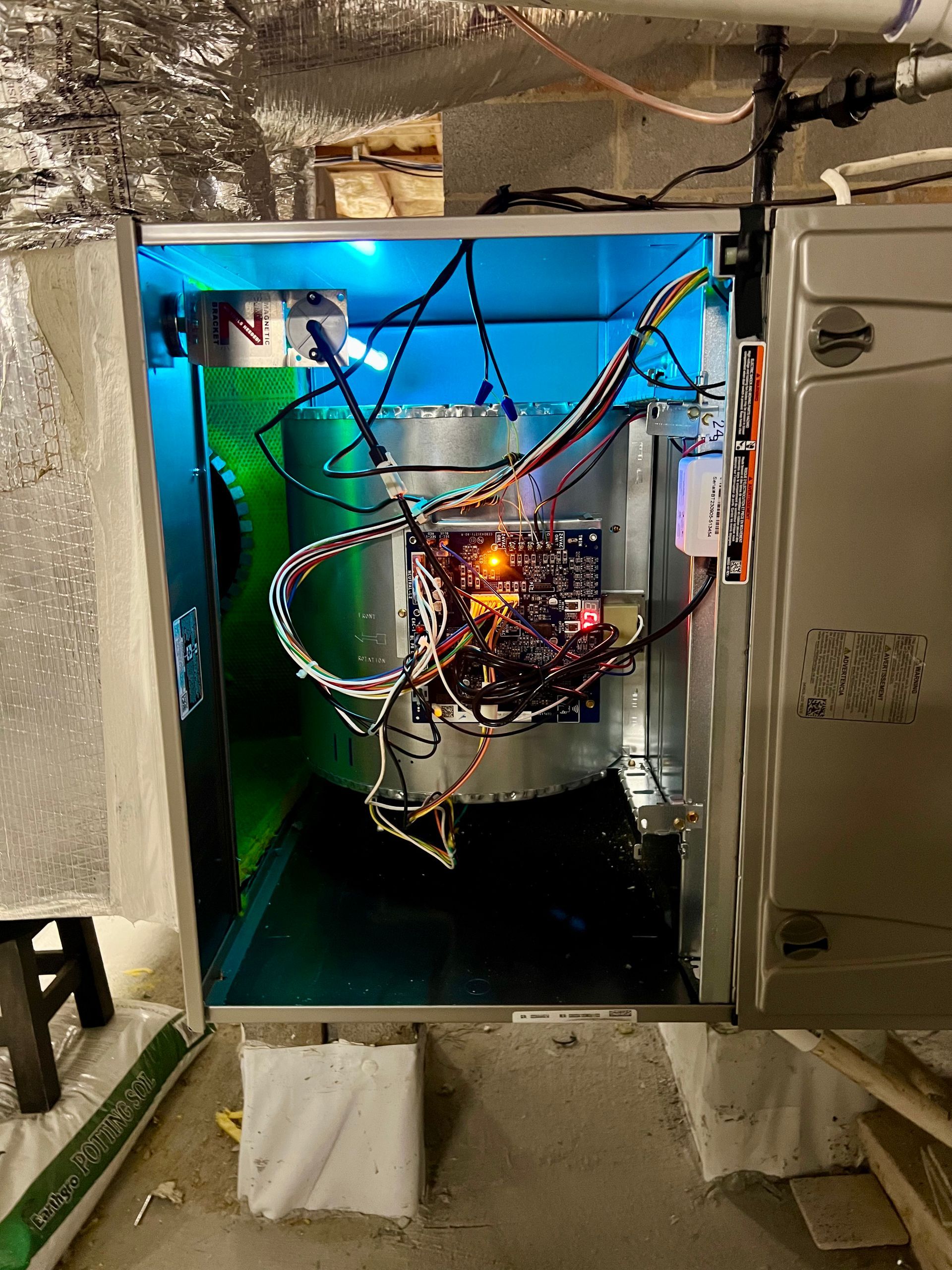 A box with a lot of wires coming out of it.