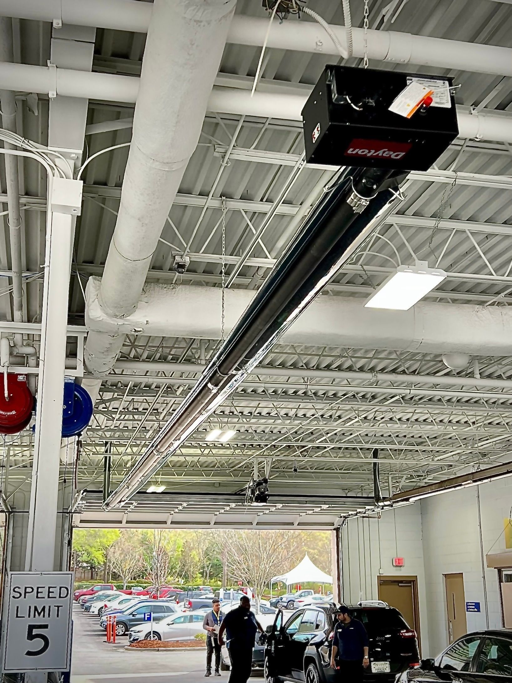 A garage with a sign that says speed limit 5