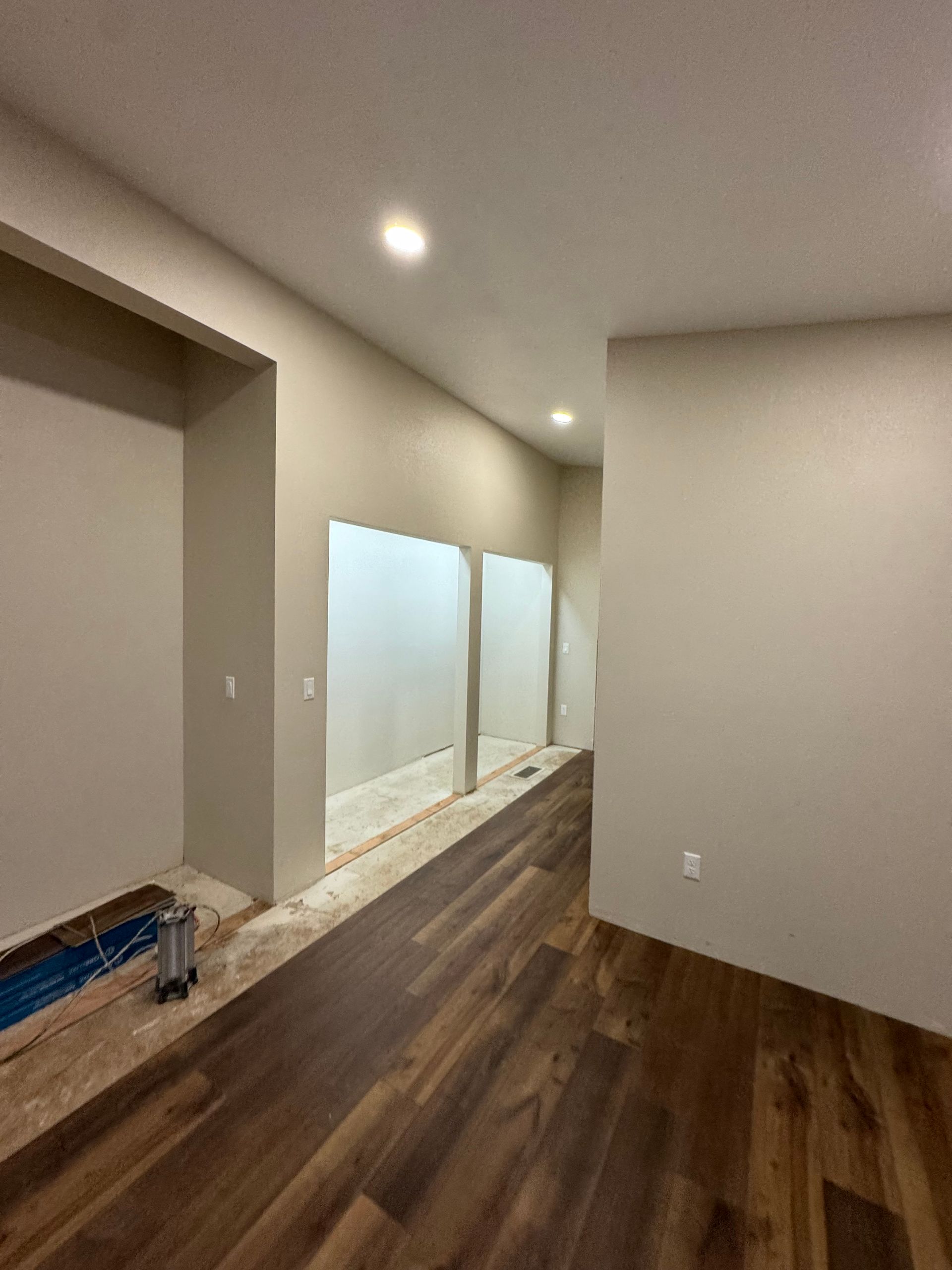 Light gray, textured wall.