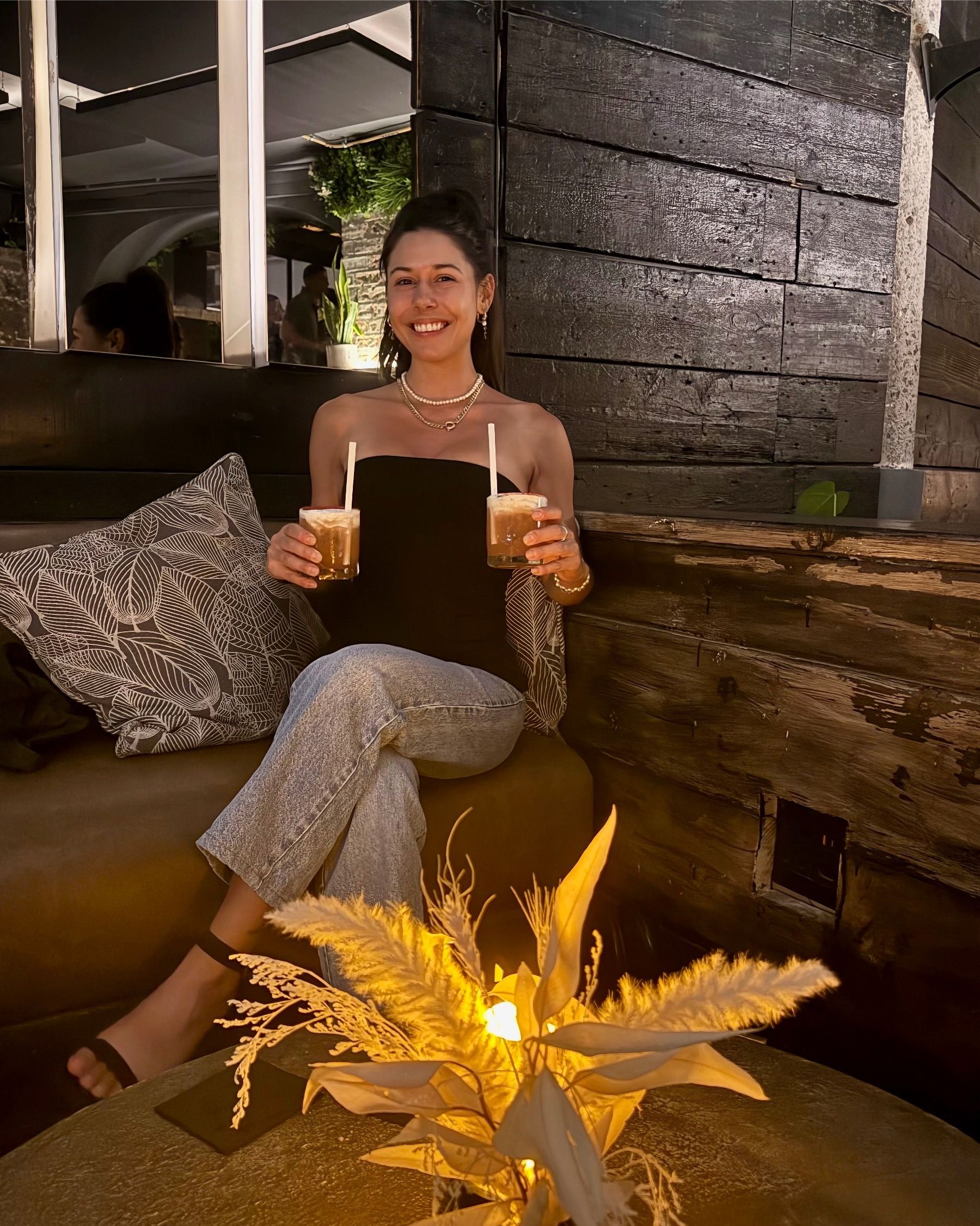 Paige Ellis Green holding the Fault Line cocktails at Batanga Cape Town lounge