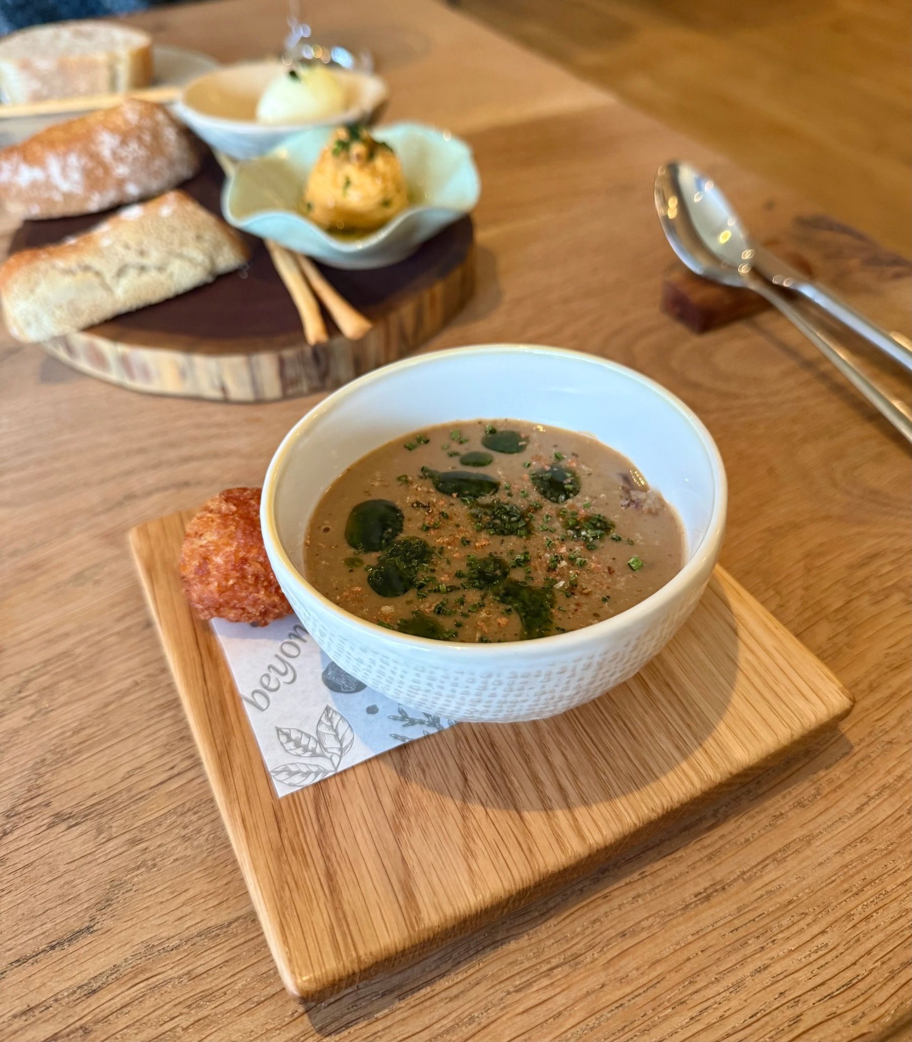 Mushroom soup with truffle arancini at Beyond Restaurant winter menu
