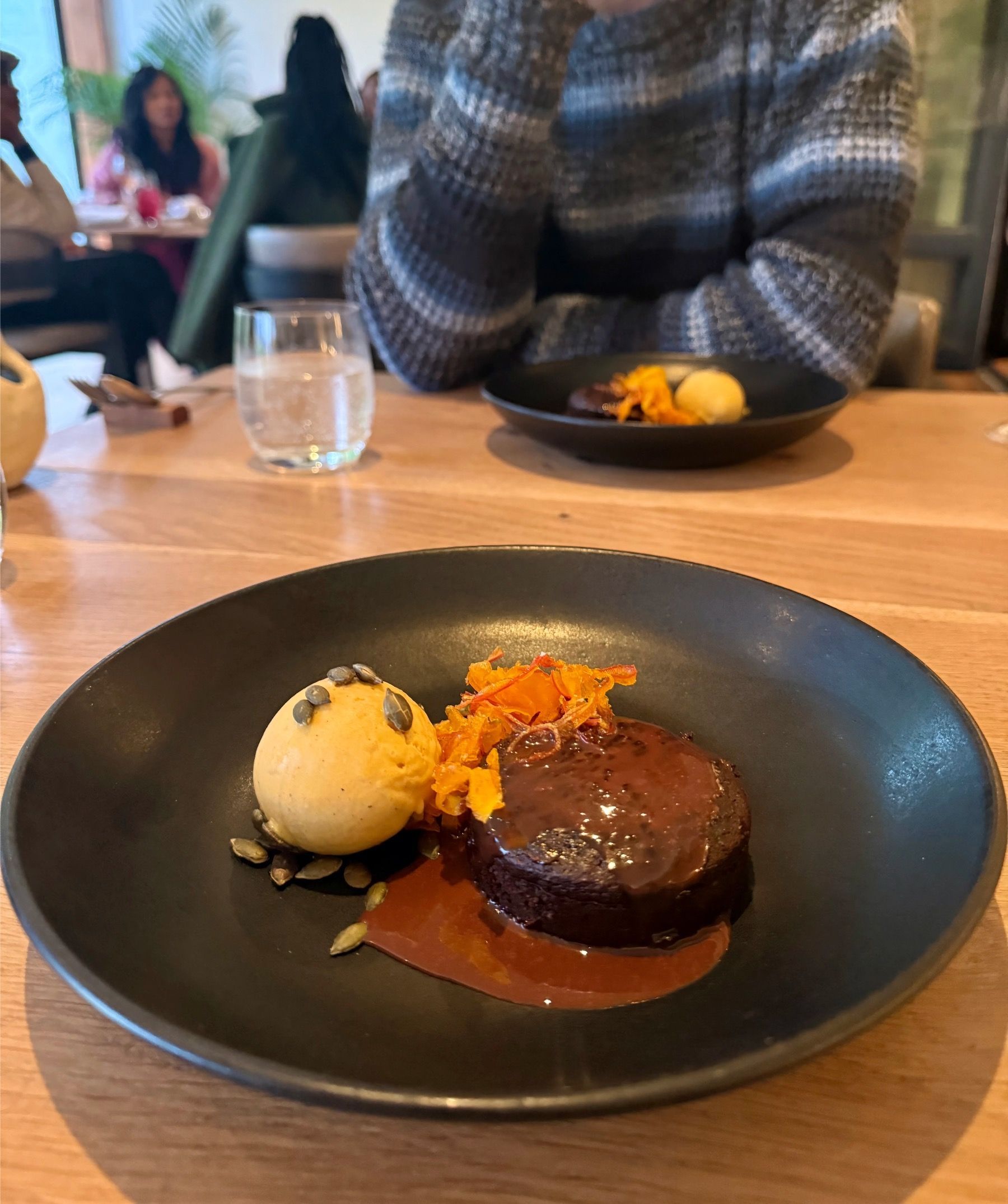 Warm brandy pudding with citrus elements and ice cream at Beyond Restaurant