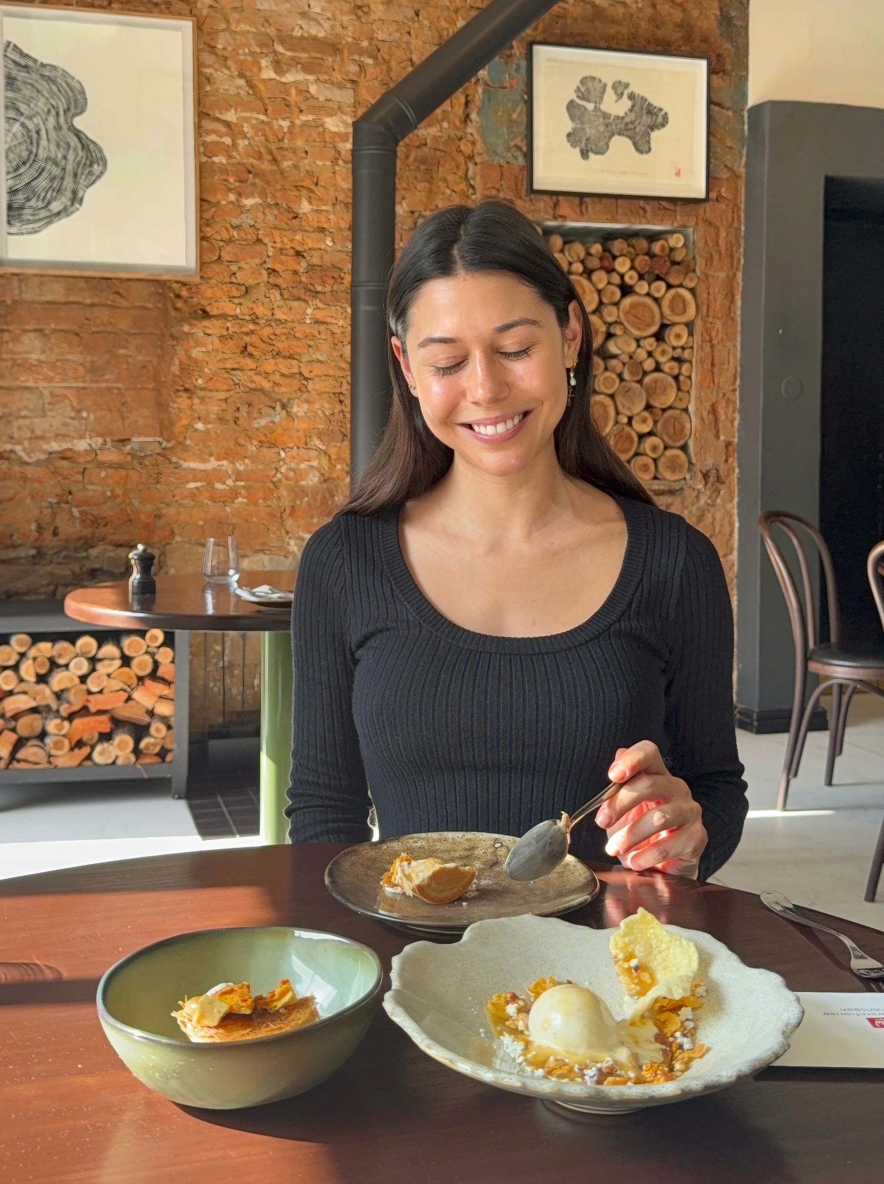 Paige tasting plated dessert at Chefs Warehouse & Canteen, layered pastry and cream with elegant fine dining presentation in Cape Town