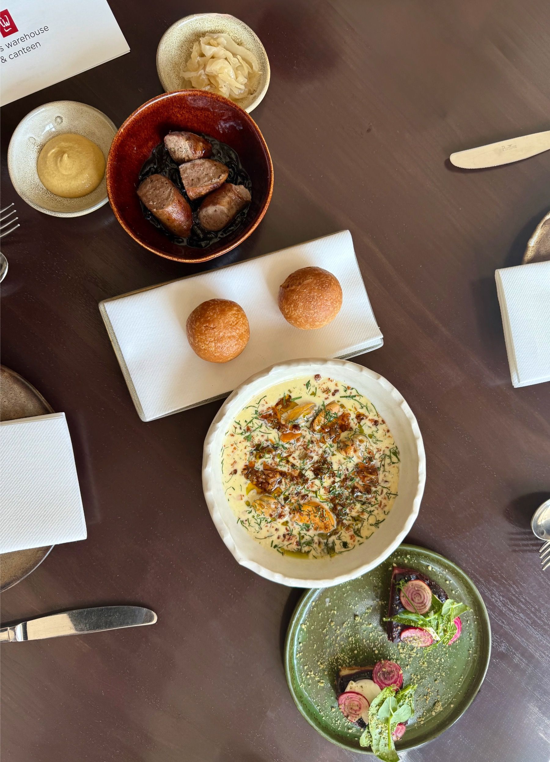 Overhead view of starters at Chefs Warehouse & Canteen including seafood and seasonal small plates
