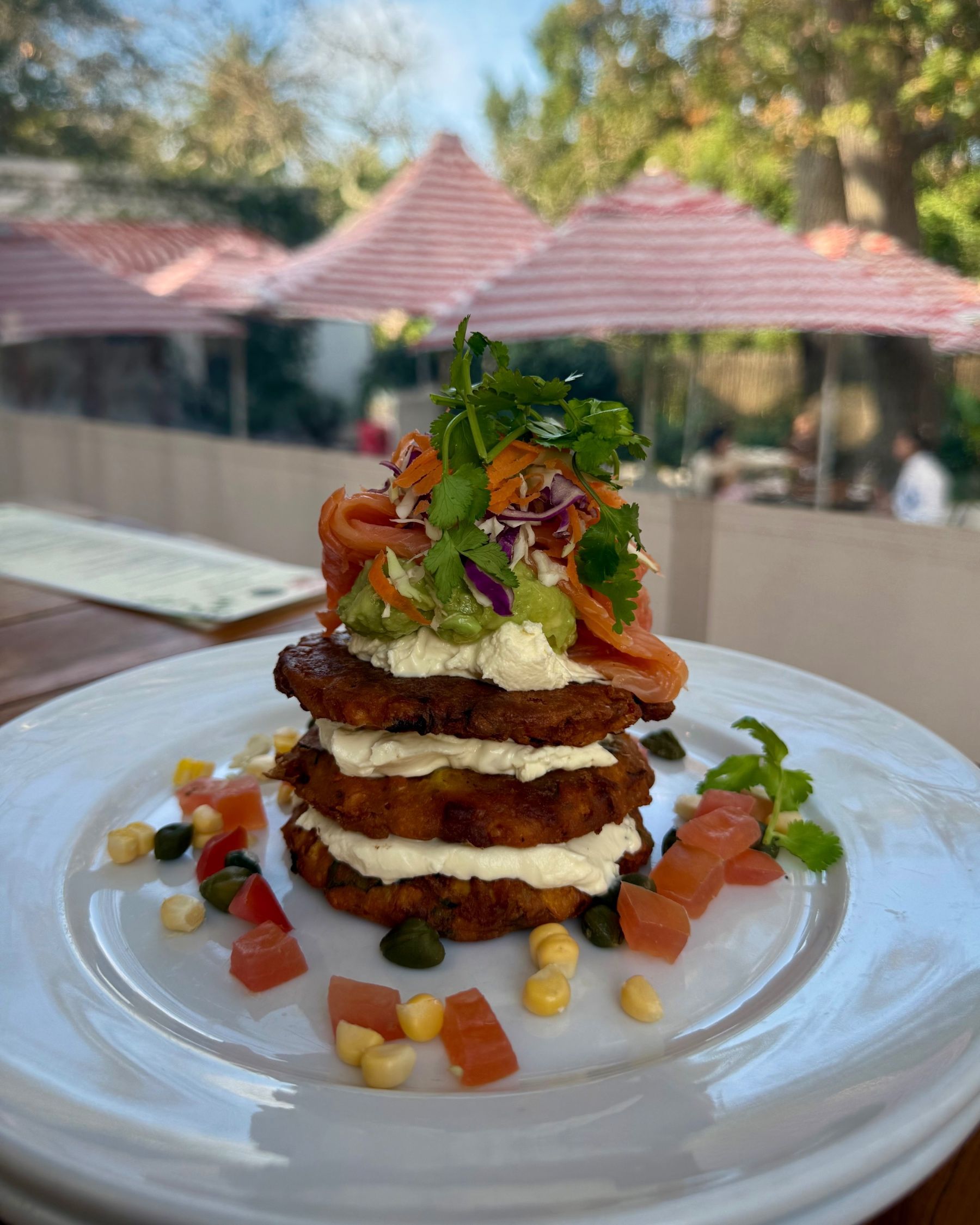 Layered sweet corn fritters with salmon at Chardonnay Deli High Constantia
