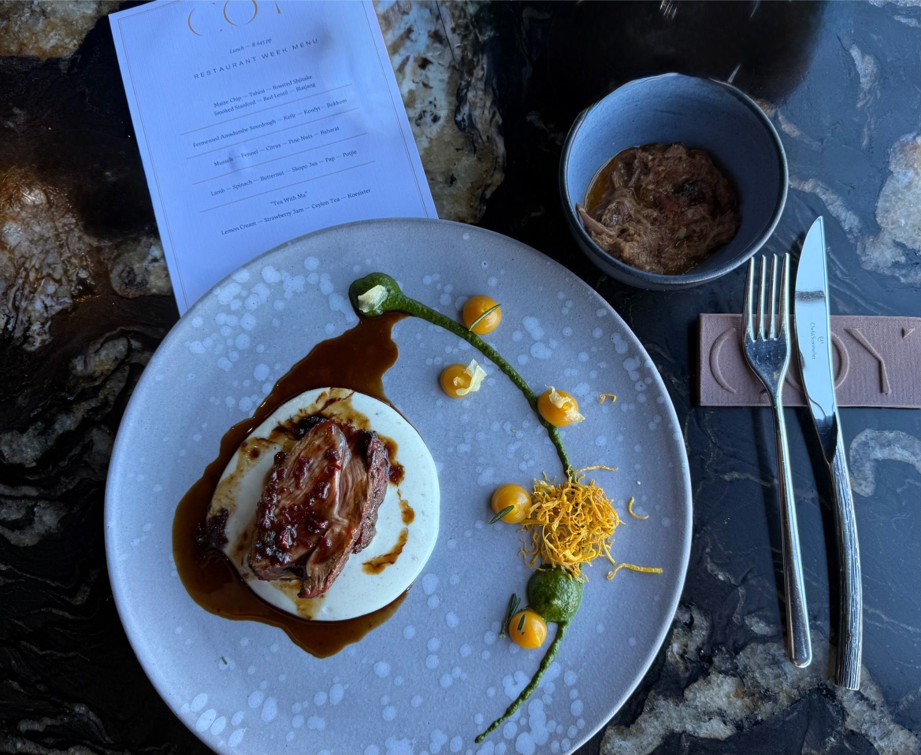 Lamb with spinach, butternut, pap, potjie and jus at Coy
