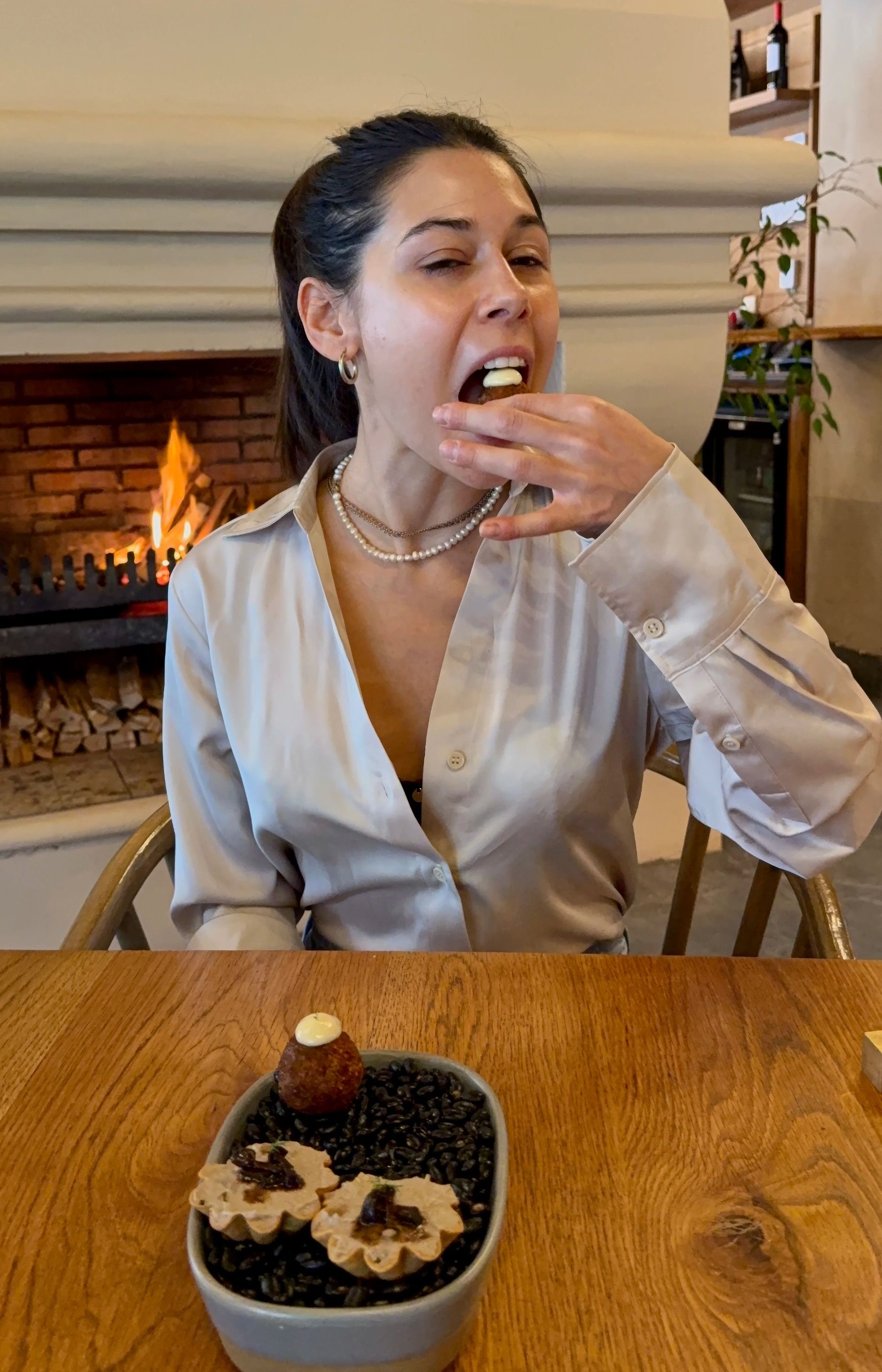 Paige enjoying beef croquette at Eleven Franschhoek restaurant
