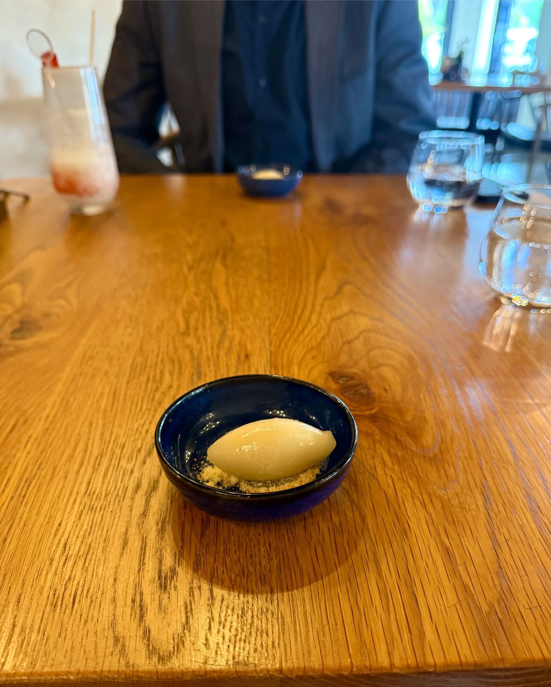 Sour sorbet palate cleanser with citrus elements served during Eleven tasting menu
