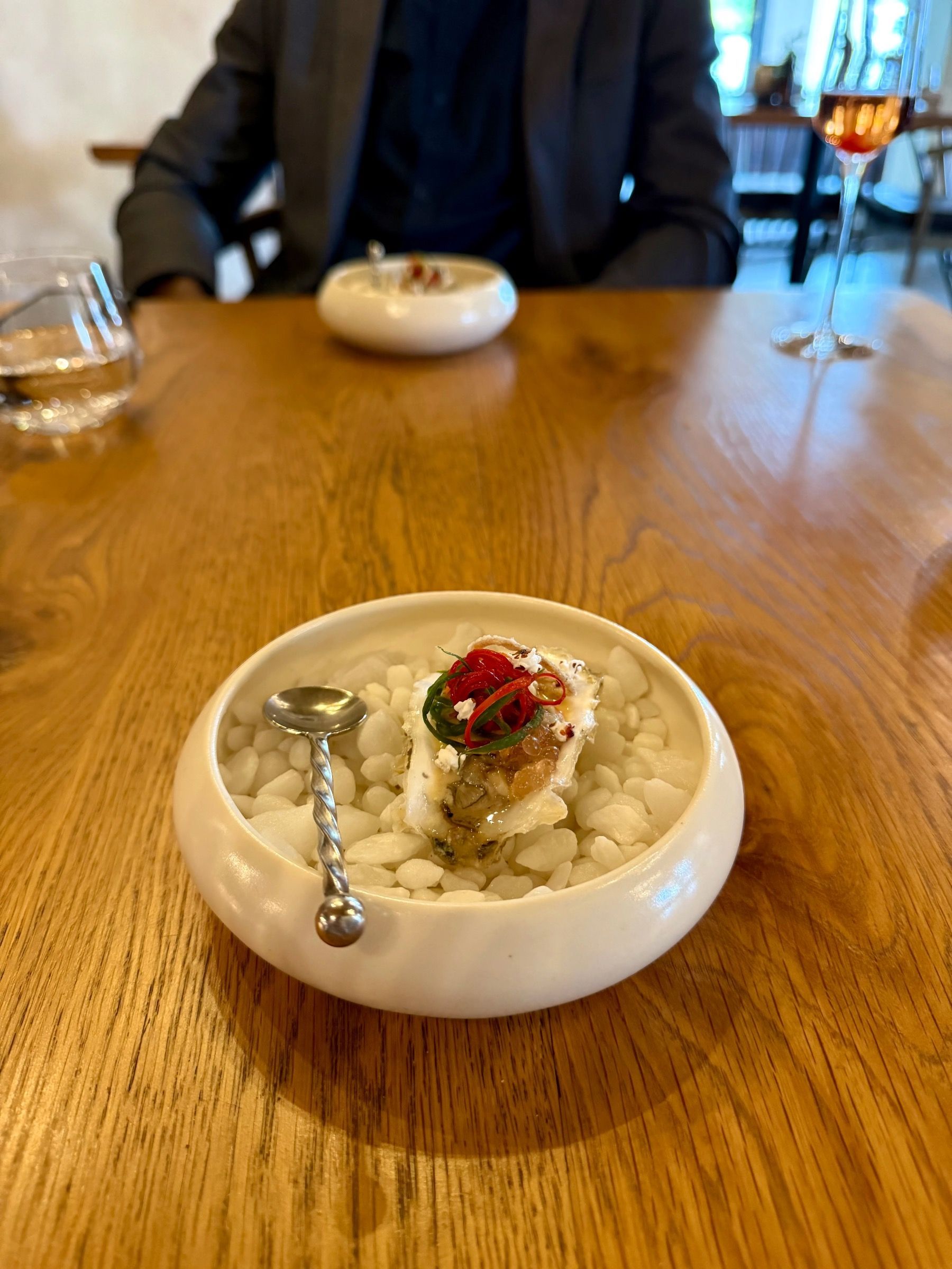 Fresh oyster with citrus, chilli and puffed grains at Eleven tasting menu
