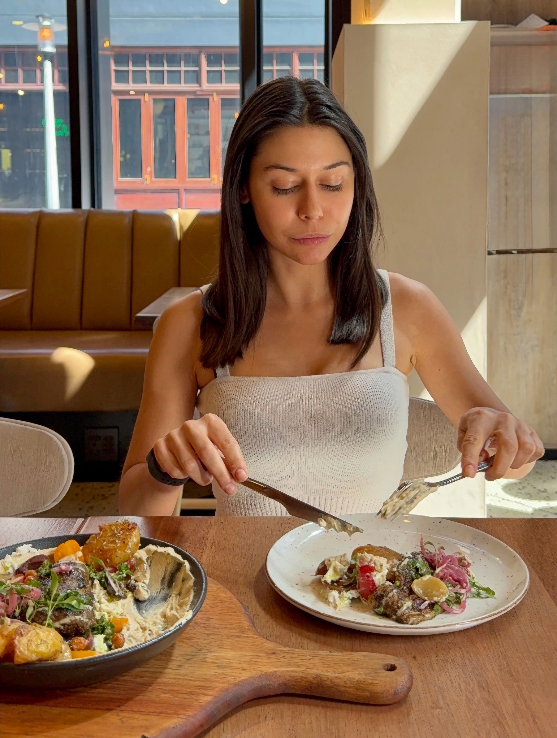 Paige eating melanzane aubergine dish at Florentin Cape Town