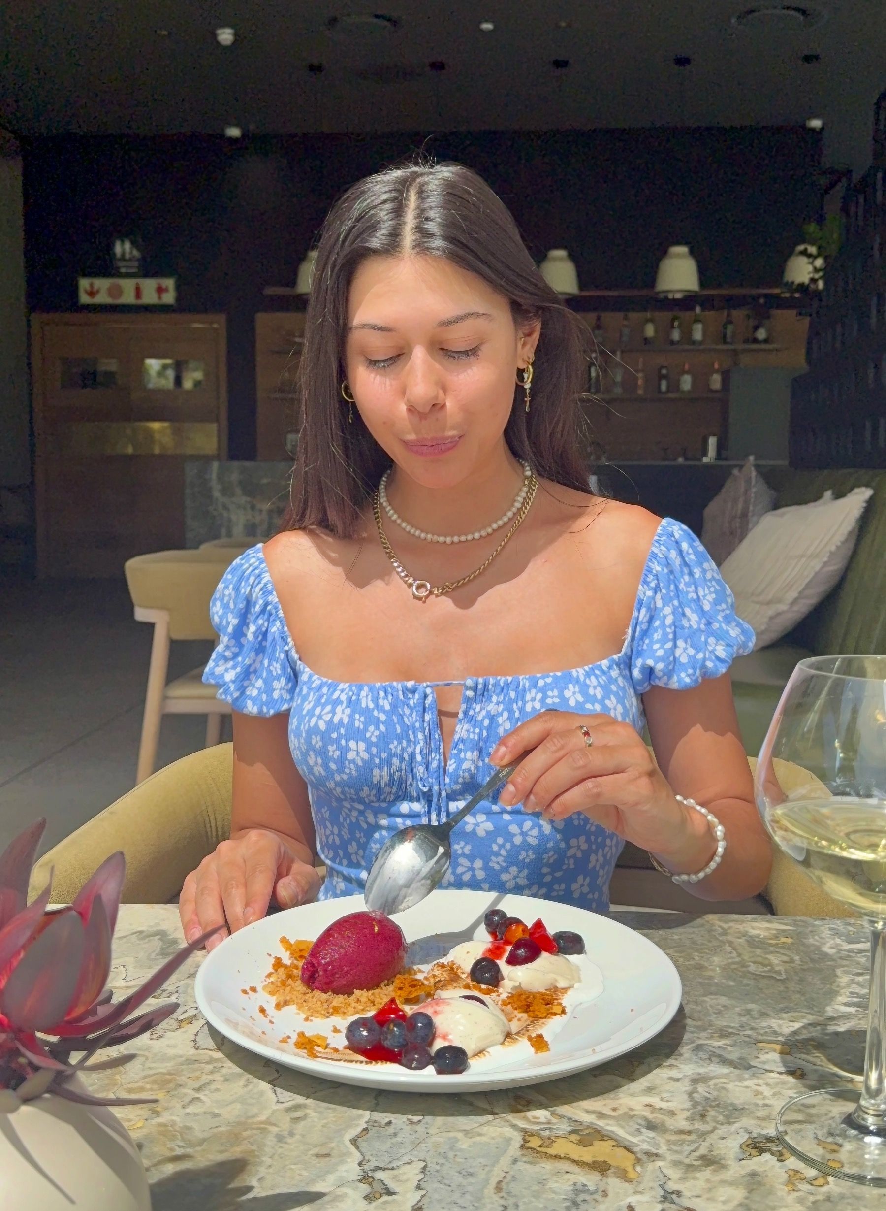 Paige Ellis Green enjoying panna cotta with toasted meringue and berry sorbet at Grub & Vine Norval