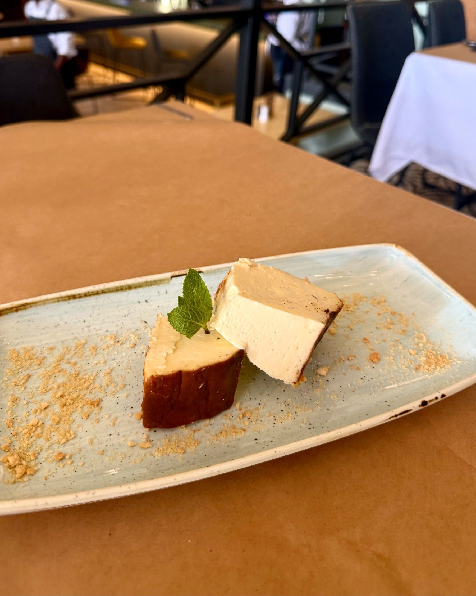 Burnt Basque cheesecake served at HQ Steakhouse Century City, creamy centre with caramelised top and minimalist plating