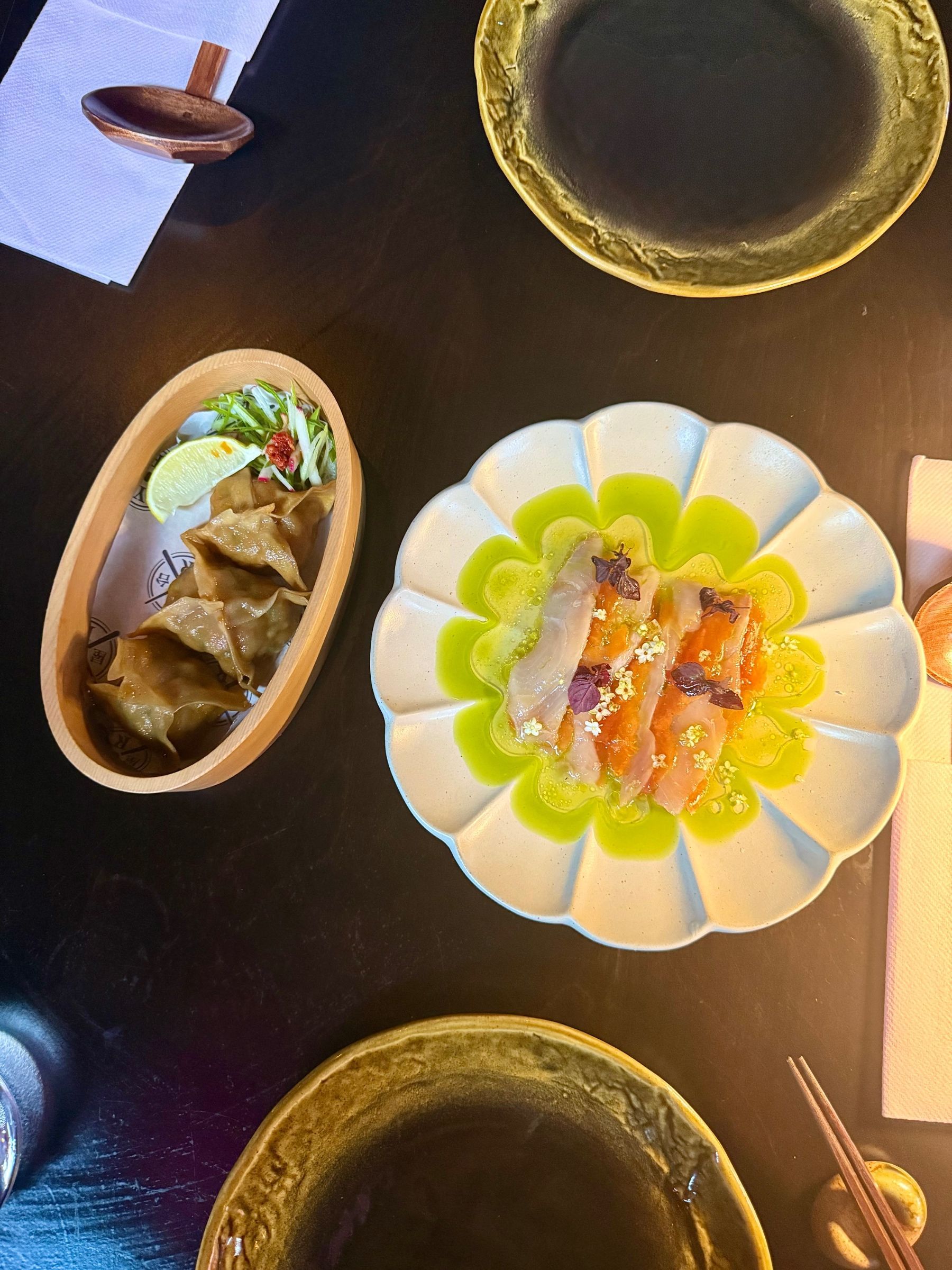 Yatai Ramen Bar prawn dumplings and sashimi with papaya
