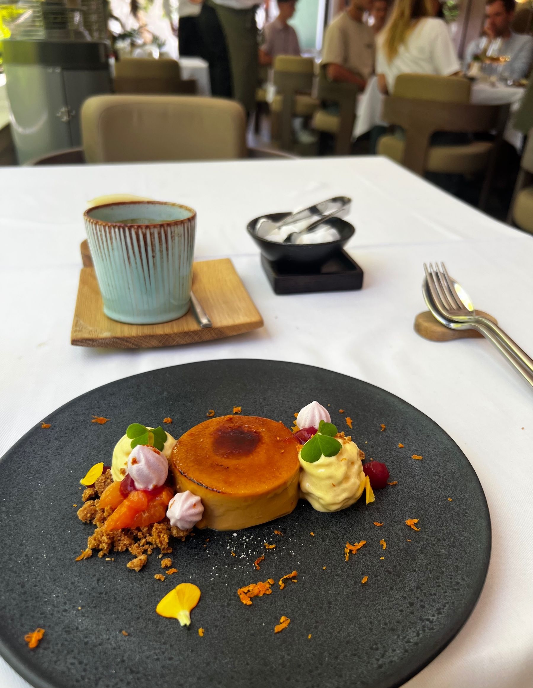Beyond Restaurant crème brûlée served with coffee

