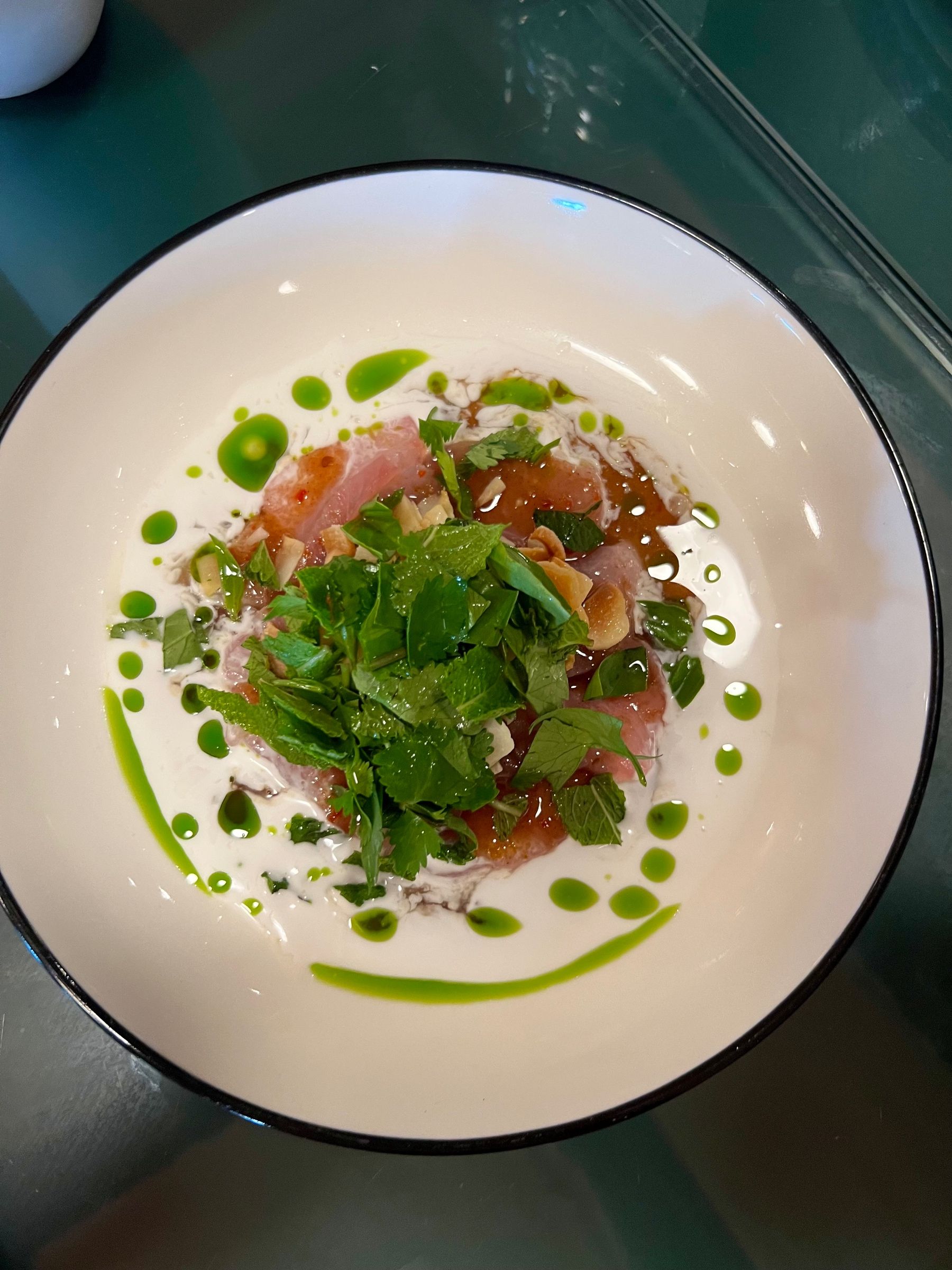 Bao Down yellowtail sashimi with fresh garnishes
