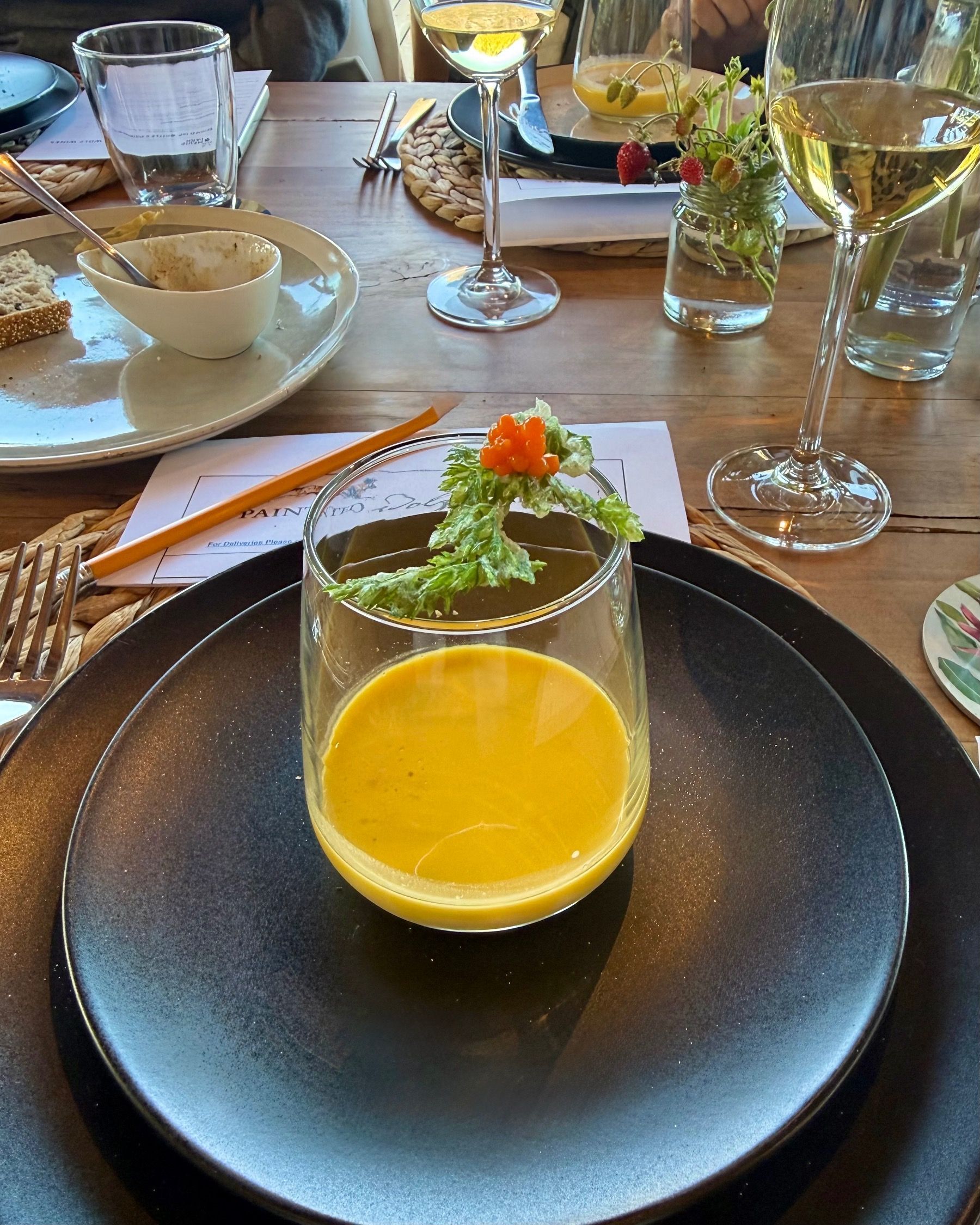 Silky carrot gazpacho with tempura carrot greens and carrot caviar paired with Chenin Blanc at Meuse Farm