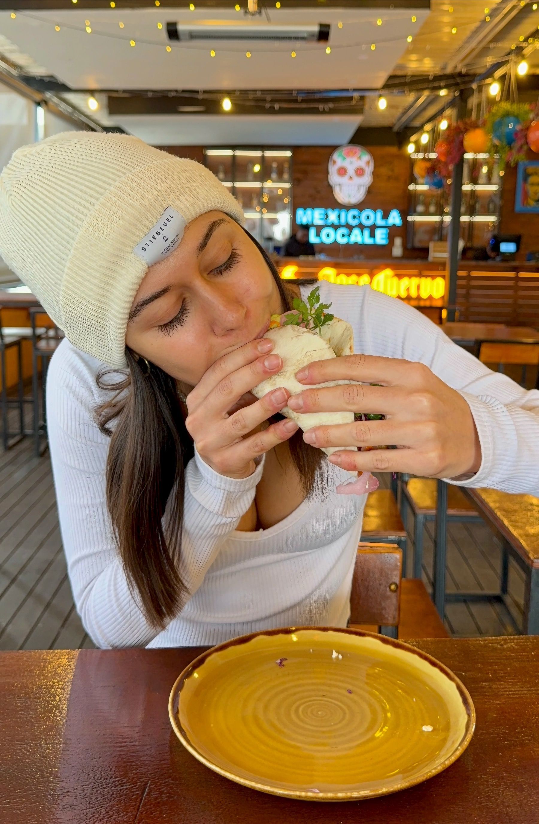Paige eating taco at Mexicola Locale Cape Town
