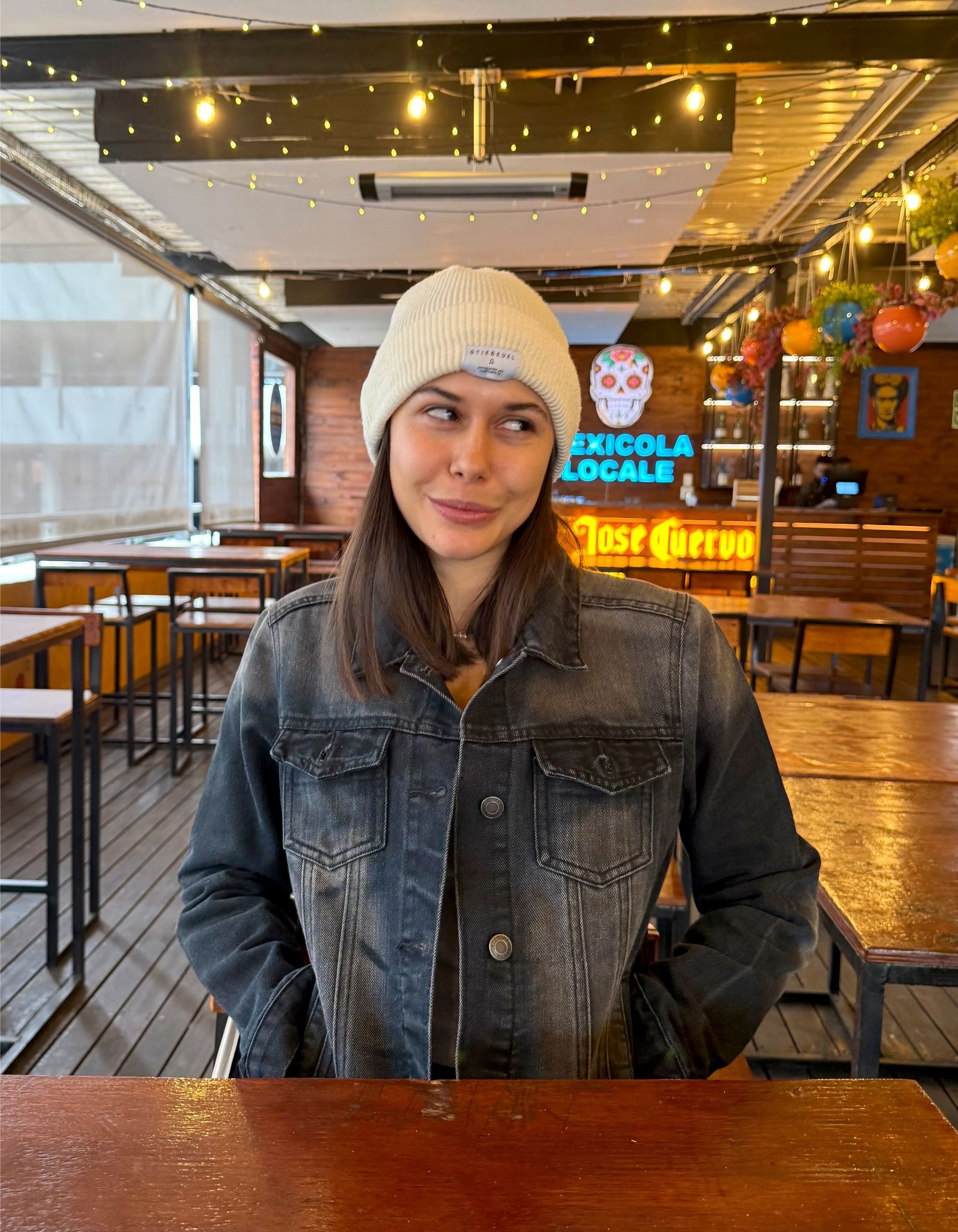 Paige seated at Mexicola Locale Cape Town restaurant
