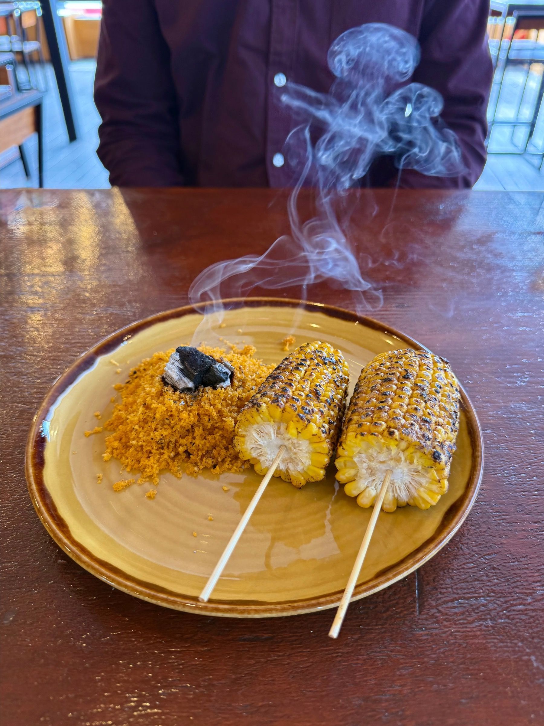 Charred Mexican street corn with crema at Mexicola Locale
