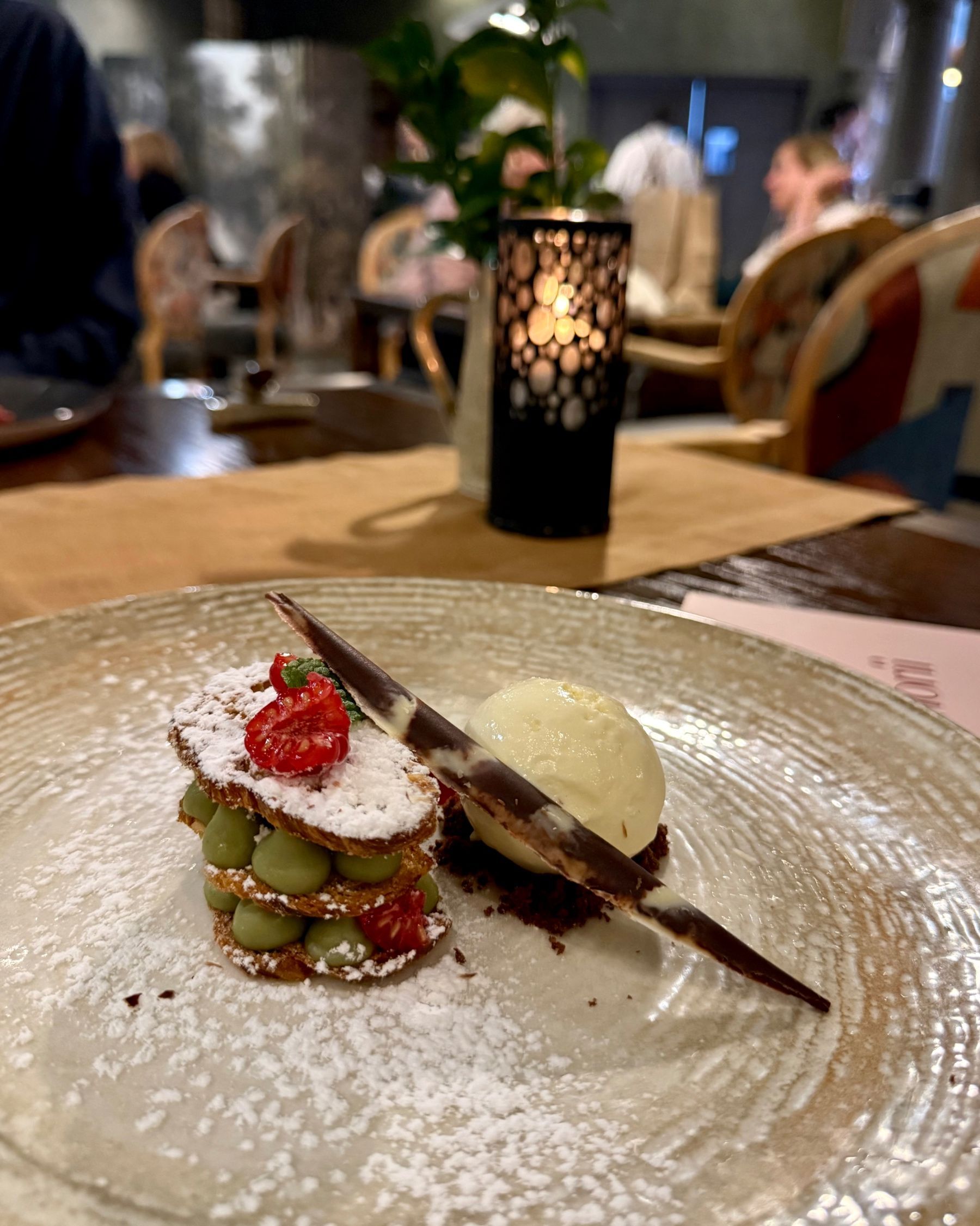 Paige is posing outside Ramenhead Cape Town at night
