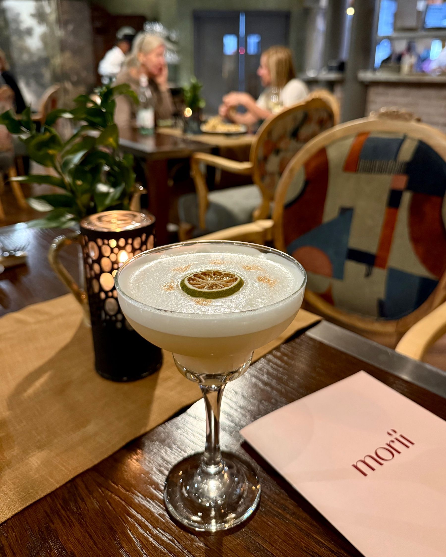 Paige is posing outside Ramenhead Cape Town at night
