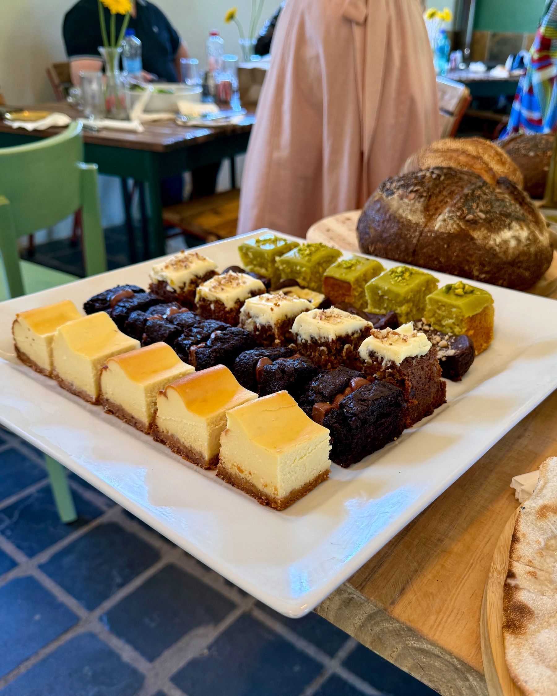 Assorted house-made desserts at Motherdough Jonkershoek launch, layered slices and baked sweets displayed in Stellenbosch.