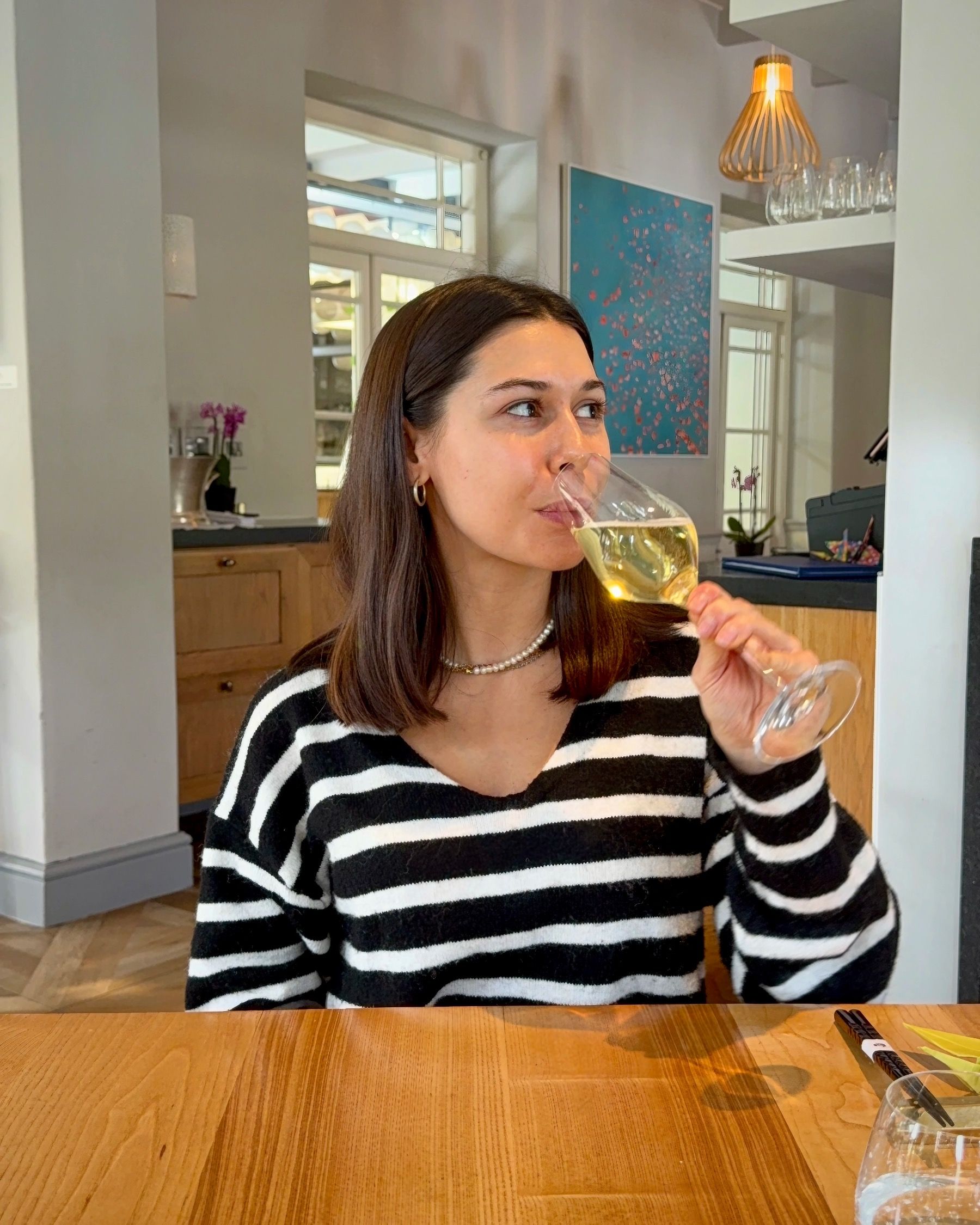 Paige enjoying MCC at Oku Franschhoek fine dining experience.